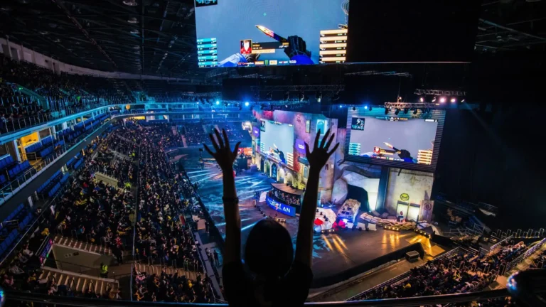 Dota 2 TI14季后赛现场，Nigma Galaxy选手在比赛中，象征电竞高水平的激烈对决与团队协作。